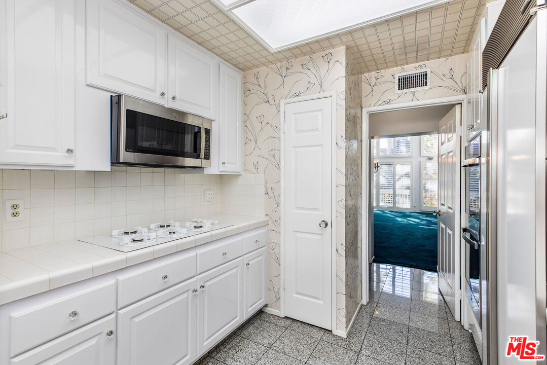 4342 Redwood Avenue, Unit C307 Marina del Rey, CA 90292 - Photo 11 of 48 a view of a kitchen with cabinets stainless steel appliances