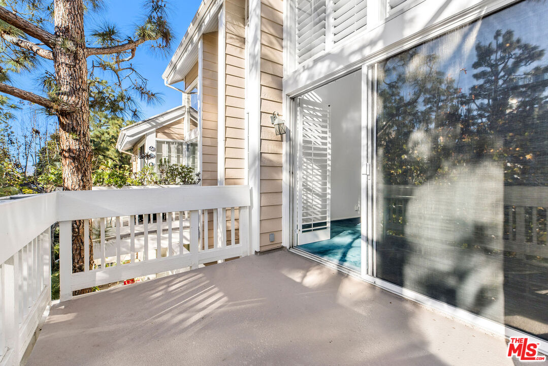 4342 Redwood Avenue, Unit C307 Marina del Rey, CA 90292 - Photo 18 of 48 a view of a balcony with wooden fence