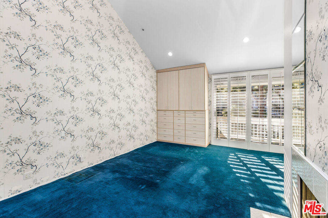 4342 Redwood Avenue, Unit C307 Marina del Rey, CA 90292 - Photo 19 of 48 a view of an empty room with wooden floor and a window