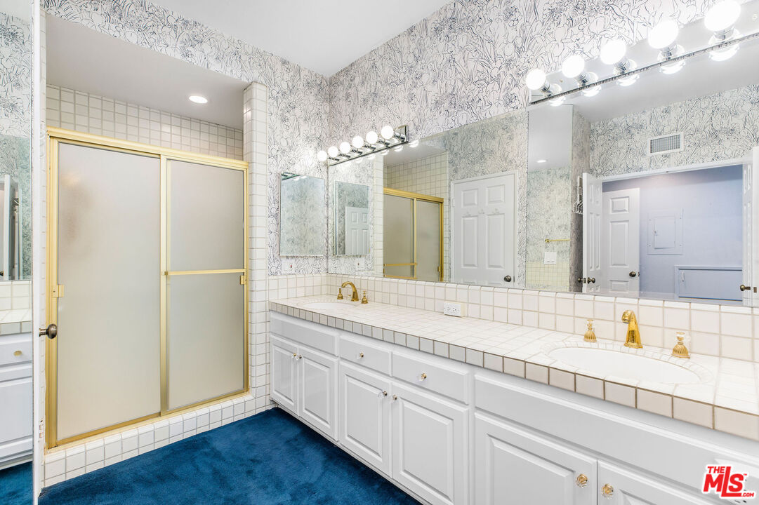 4342 Redwood Avenue, Unit C307 Marina del Rey, CA 90292 - Photo 23 of 48 a bathroom with a double vanity sink mirror and double