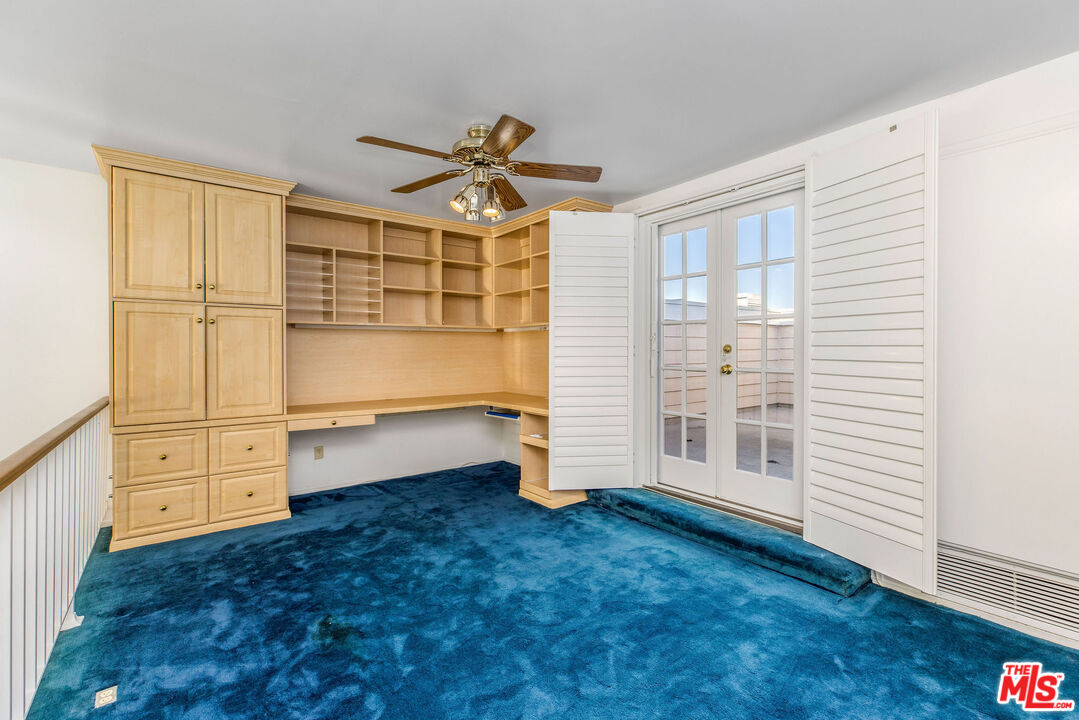 4342 Redwood Avenue, Unit C307 Marina del Rey, CA 90292 - Photo 32 of 48 a view of an empty room with a cabinet and a window