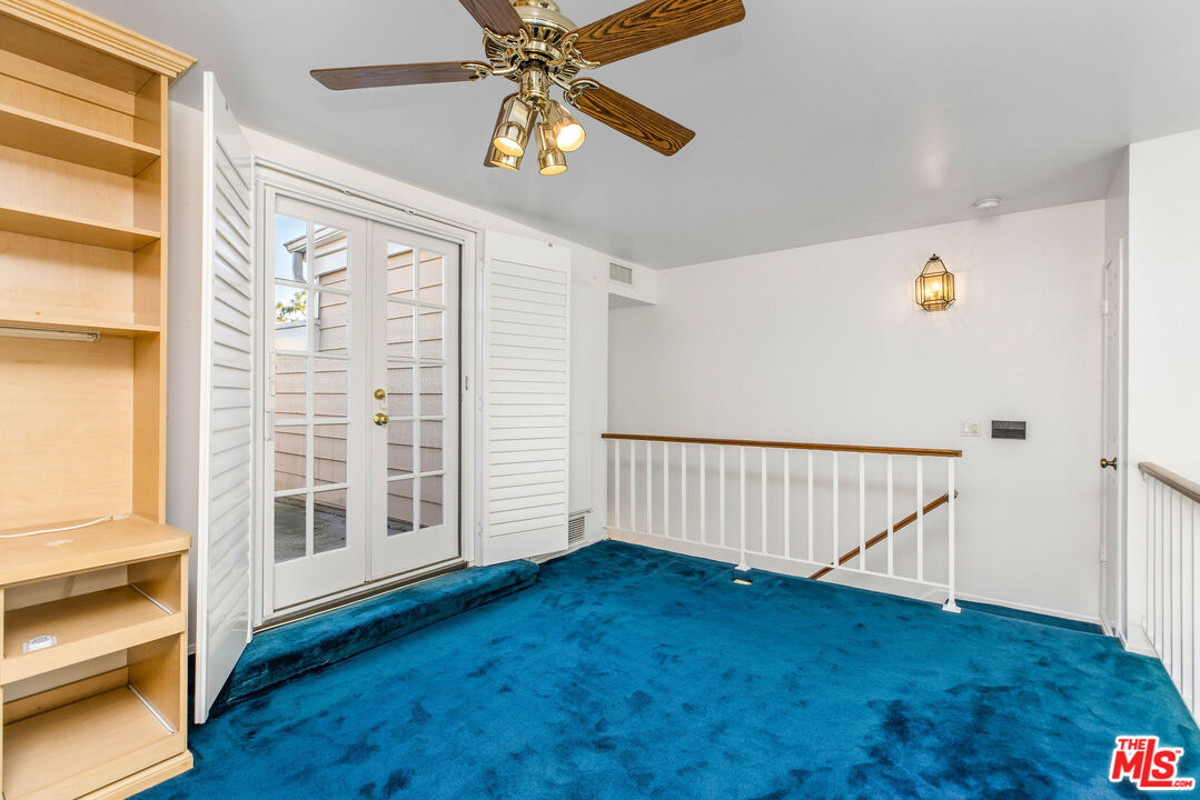 4342 Redwood Avenue, Unit C307 Marina del Rey, CA 90292 - Photo 33 of 48 a view of an empty room with wooden floor and windows