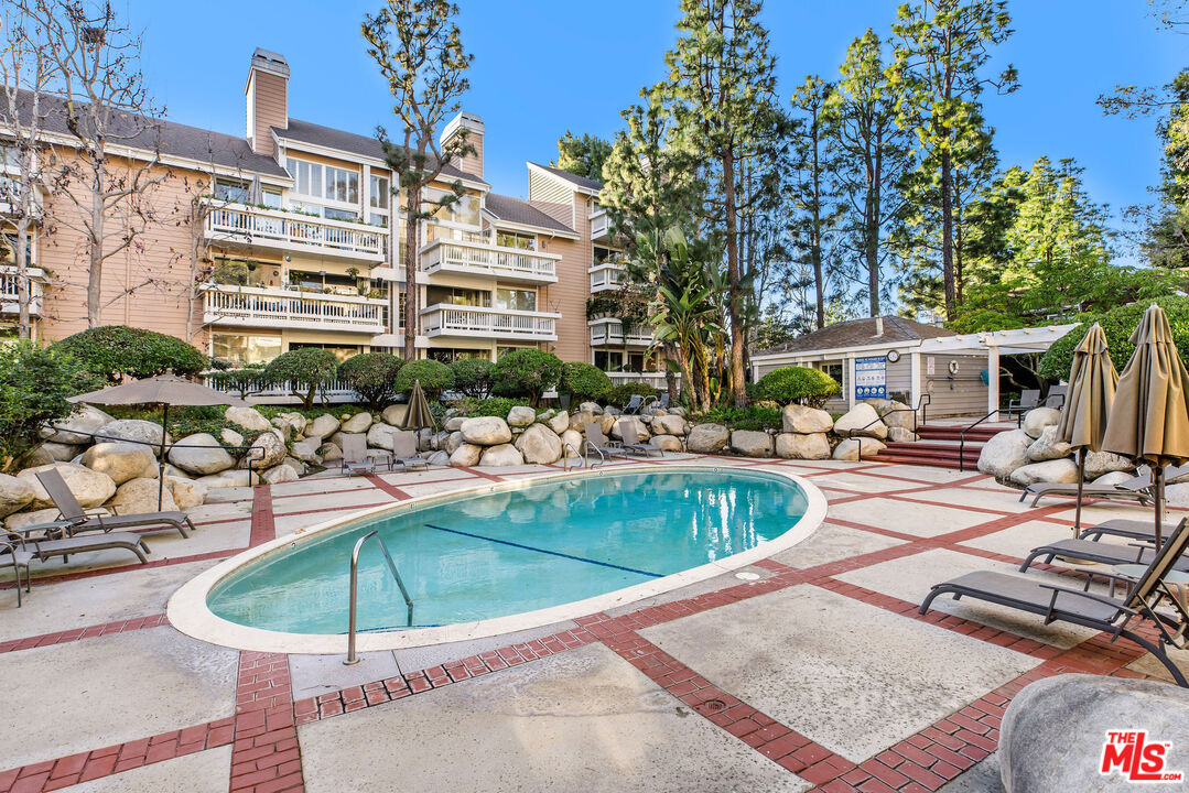 4342 Redwood Avenue, Unit C307 Marina del Rey, CA 90292 - Photo 37 of 48 a view of a swimming pool with a patio