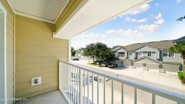 a view of a house with large windows