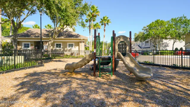 a view of a house with backyard and porch