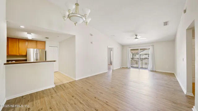 a view of a livingroom with wooden floor