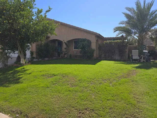 a view of a back yard of the house