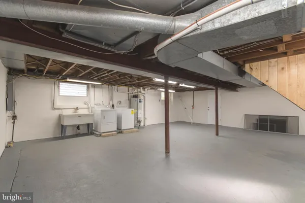 a view of an empty room with stairs