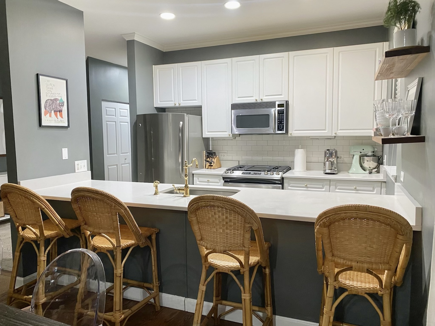 4315 North Kenmore Avenue, Unit 2S Chicago, IL 60613 - Photo 7 of 27 a kitchen with stainless steel appliances granite countertop a stove top oven a sink refrigerator and cabinets