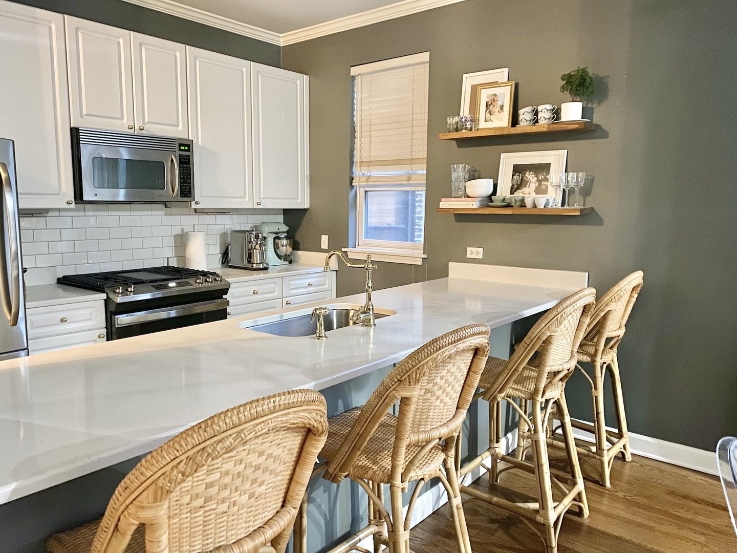 4315 North Kenmore Avenue, Unit 2S Chicago, IL 60613 - Photo 8 of 27 a kitchen with stainless steel appliances a stove a sink and a microwave