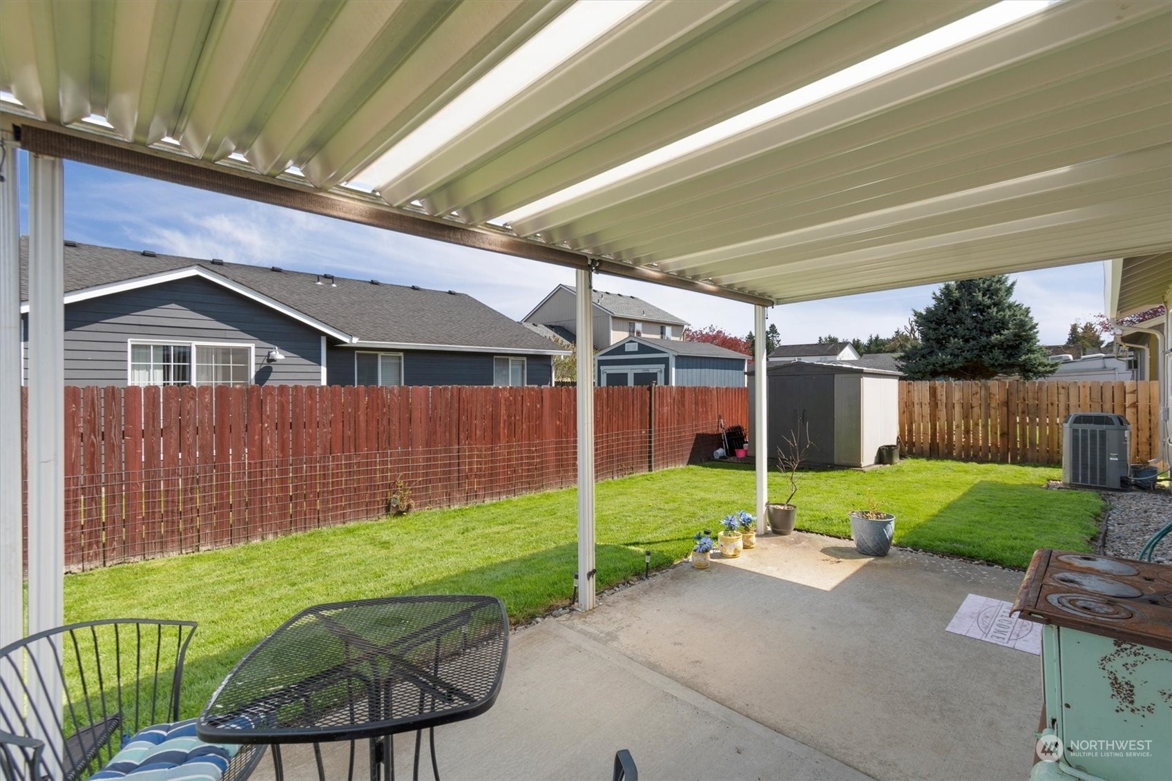 119 Abbey Road Kelso, WA 98626 - Photo 12 of 27 a view of backyard with table and chairs and wooden fence