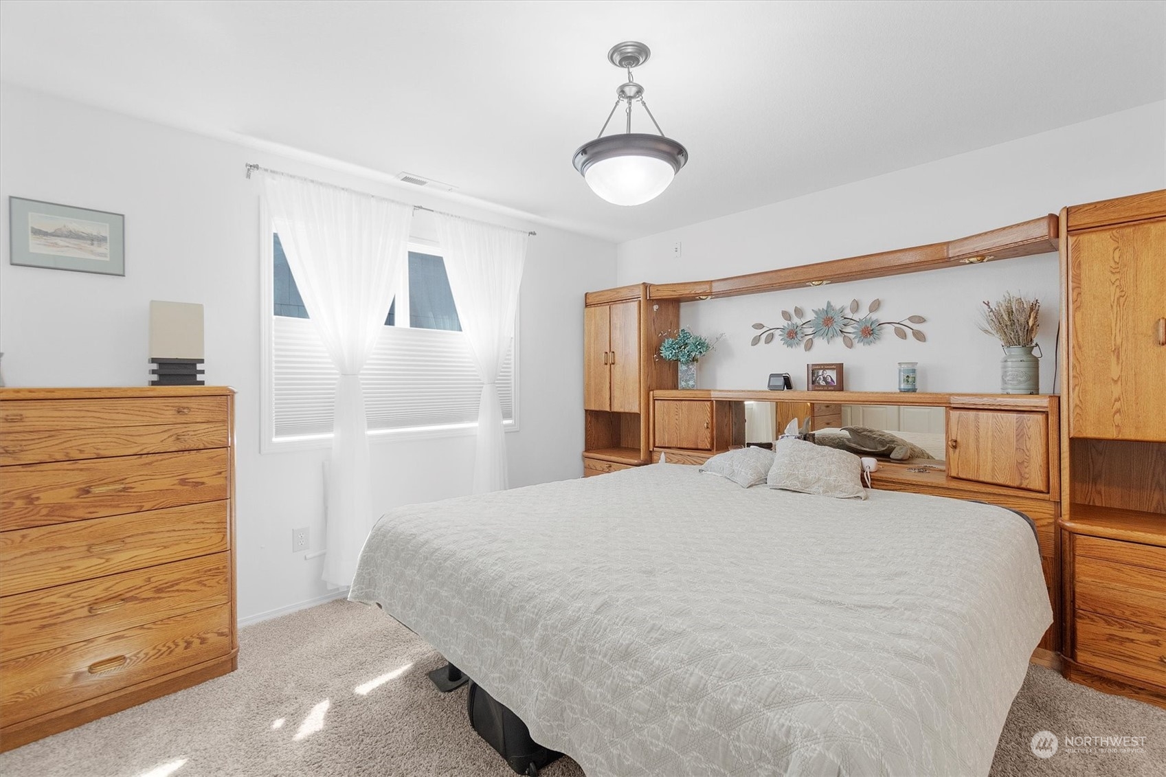 119 Abbey Road Kelso, WA 98626 - Photo 25 of 27 a bedroom with a bed and wooden floor