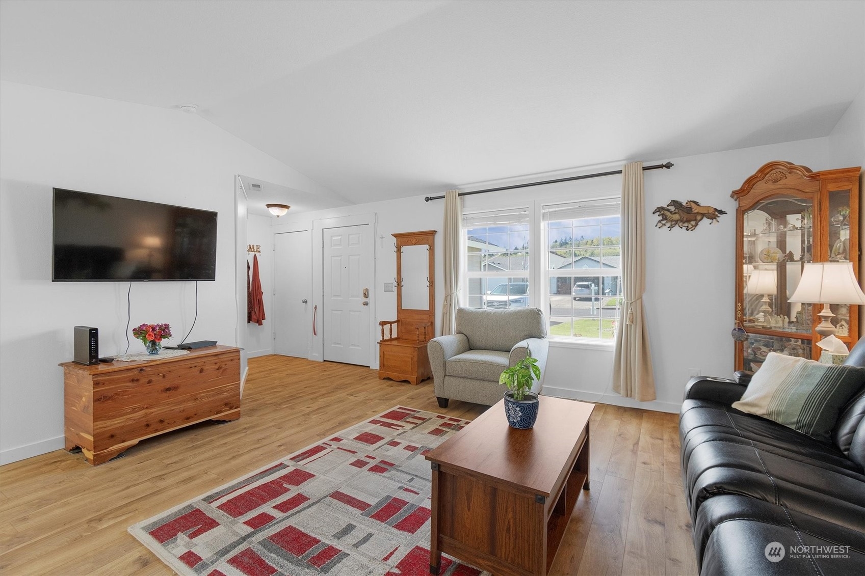 119 Abbey Road Kelso, WA 98626 - Photo 4 of 27 a living room with furniture and a flat screen tv