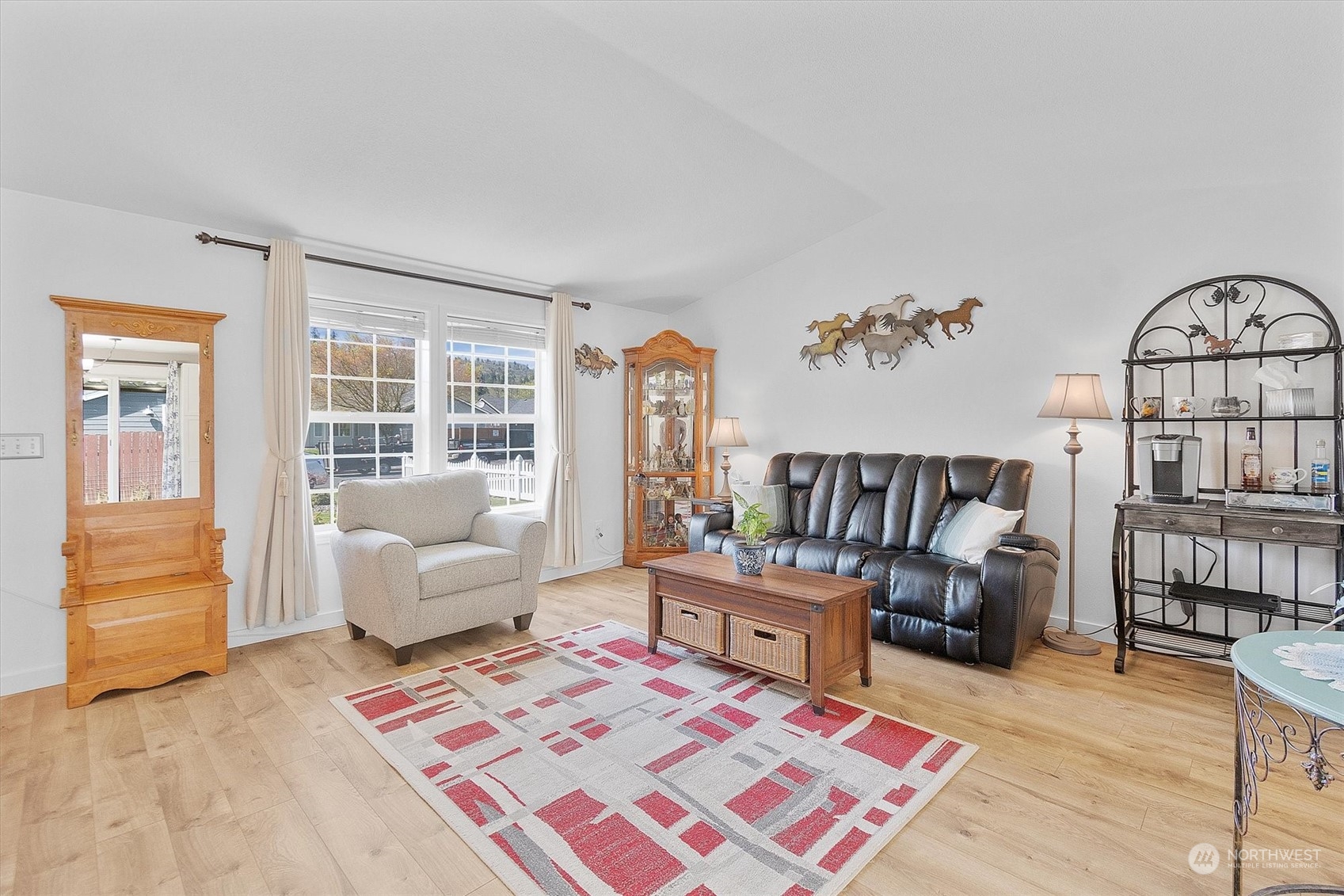 119 Abbey Road Kelso, WA 98626 - Photo 5 of 27 a living room with furniture and a floor to ceiling window