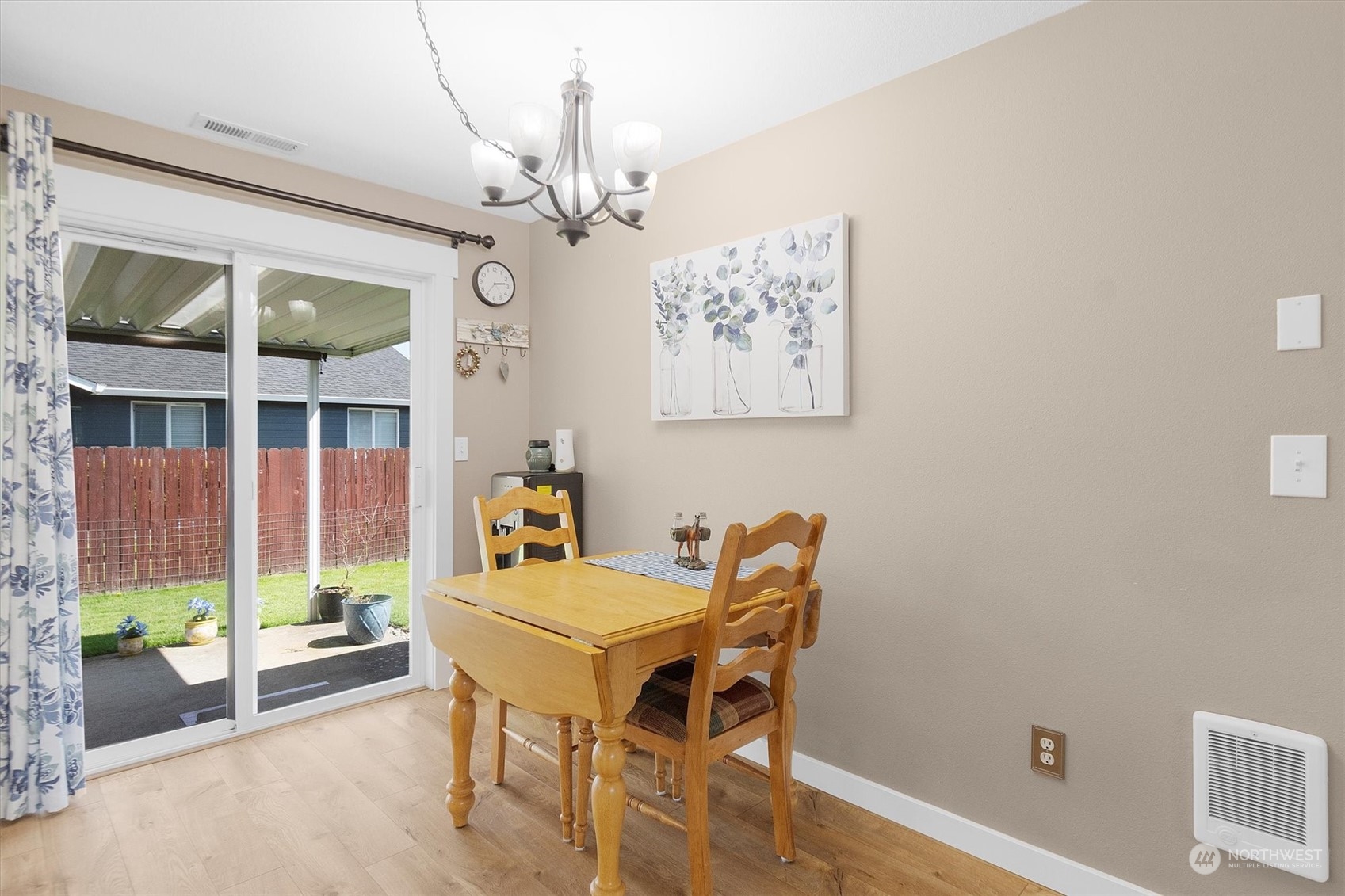 119 Abbey Road Kelso, WA 98626 - Photo 7 of 27 a dining room with furniture a chandelier and wooden floor