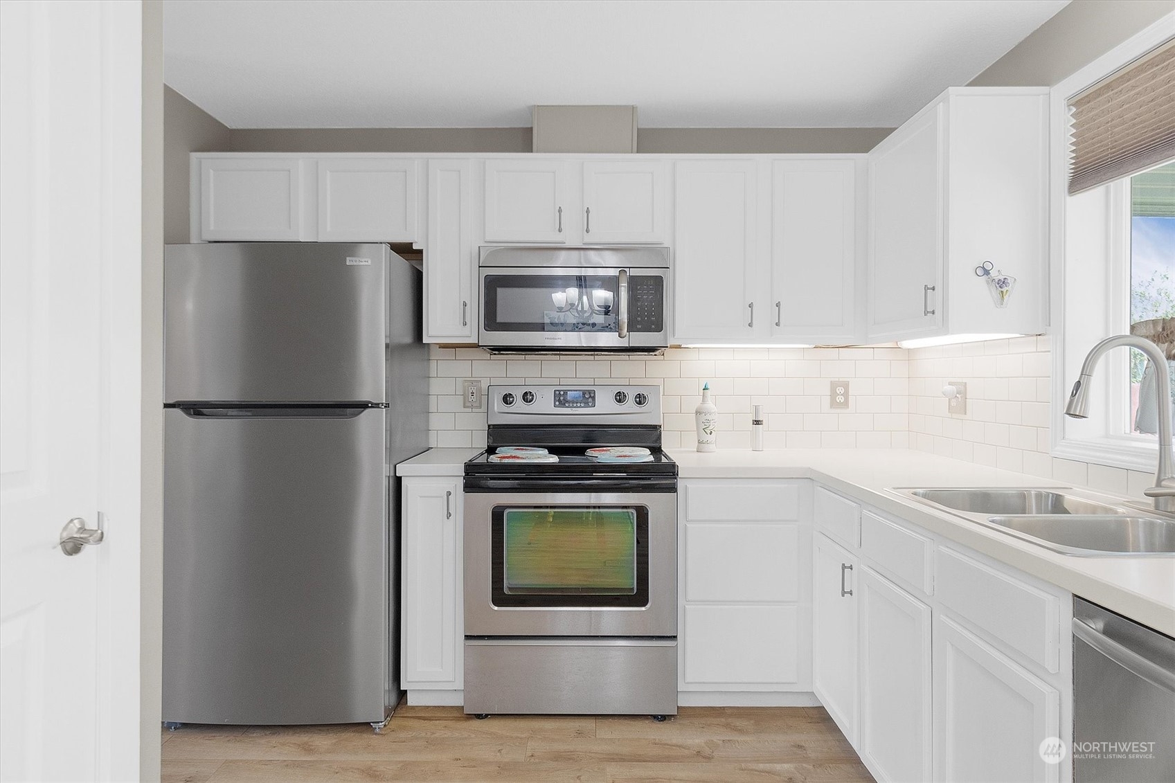 119 Abbey Road Kelso, WA 98626 - Photo 8 of 27 a kitchen with cabinets stainless steel appliances and a sink