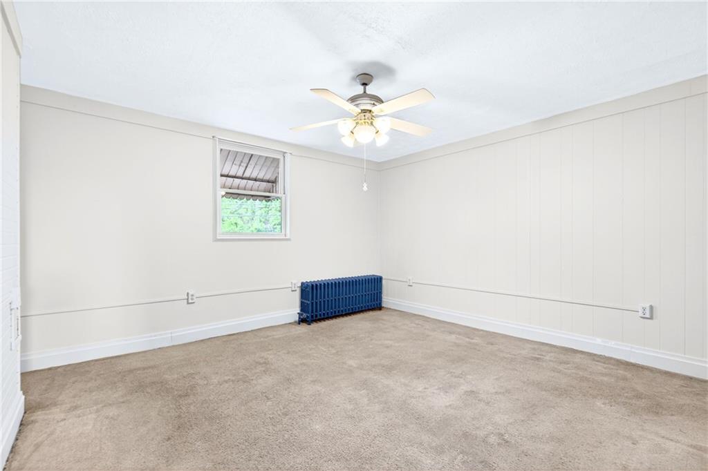 520 Stokes Avenue Braddock, PA 15104 - Photo 15 of 47 an empty room with windows and fan