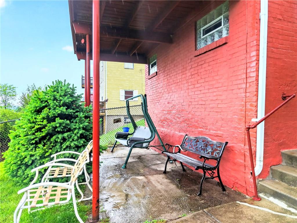 520 Stokes Avenue Braddock, PA 15104 - Photo 36 of 47 a bench sitting in backside of a building