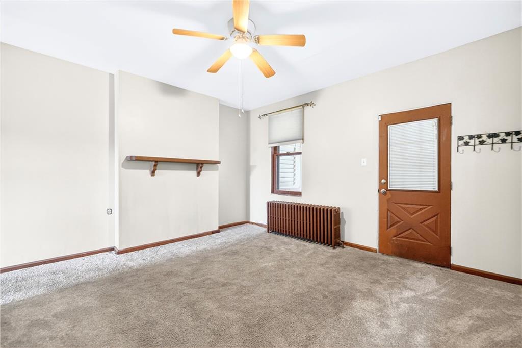 520 Stokes Avenue Braddock, PA 15104 - Photo 8 of 47 an empty room with closet and a chandelier fan