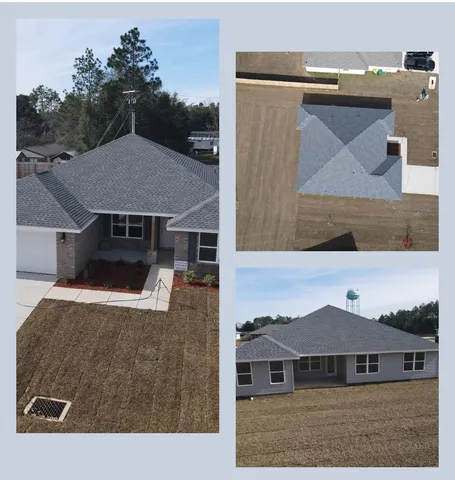 a aerial view of a house with a yard