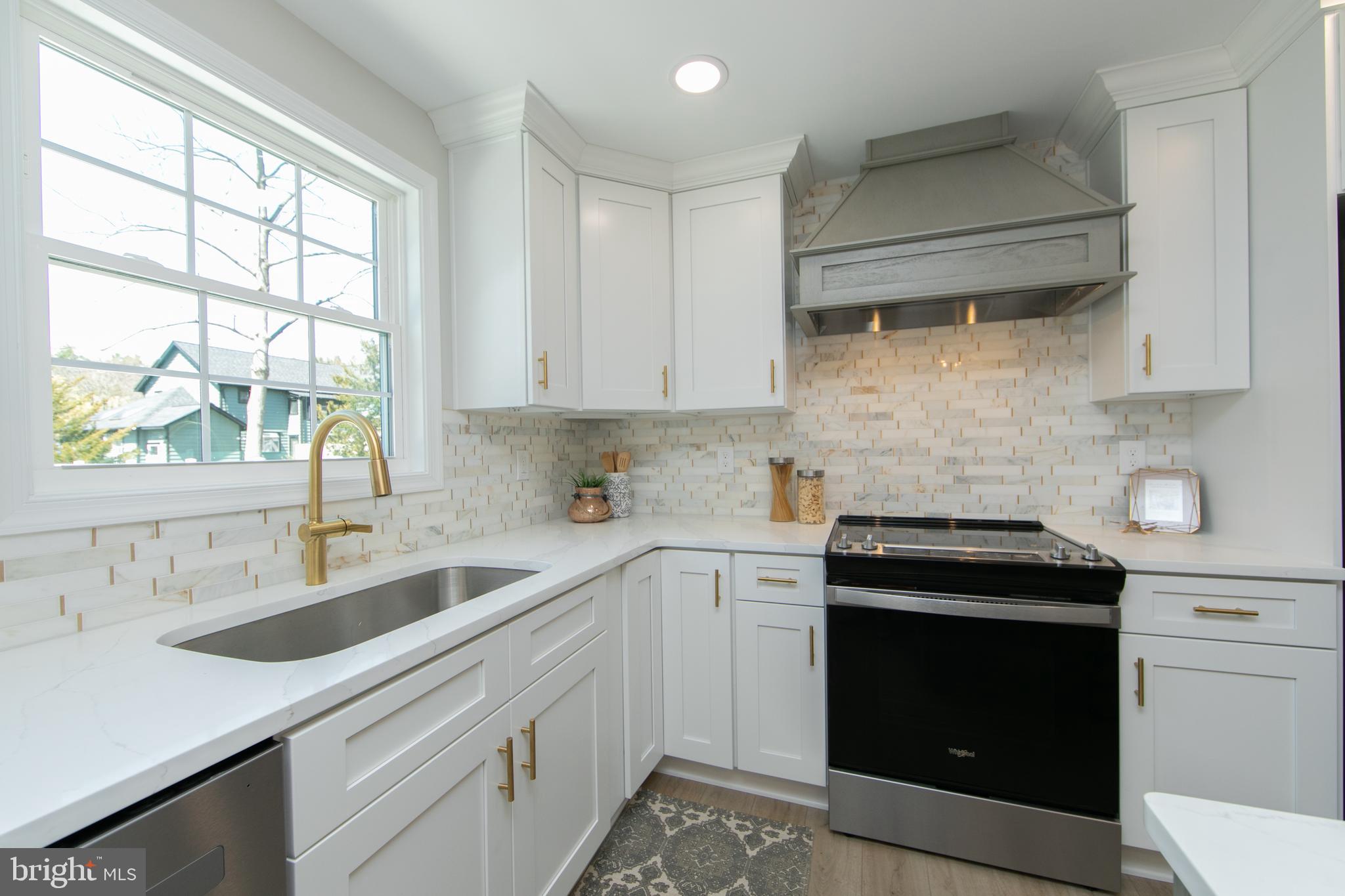 1324 Charleston Road Cherry Hill, NJ 08034 - Photo 11 of 34 a kitchen with a sink stove and cabinets