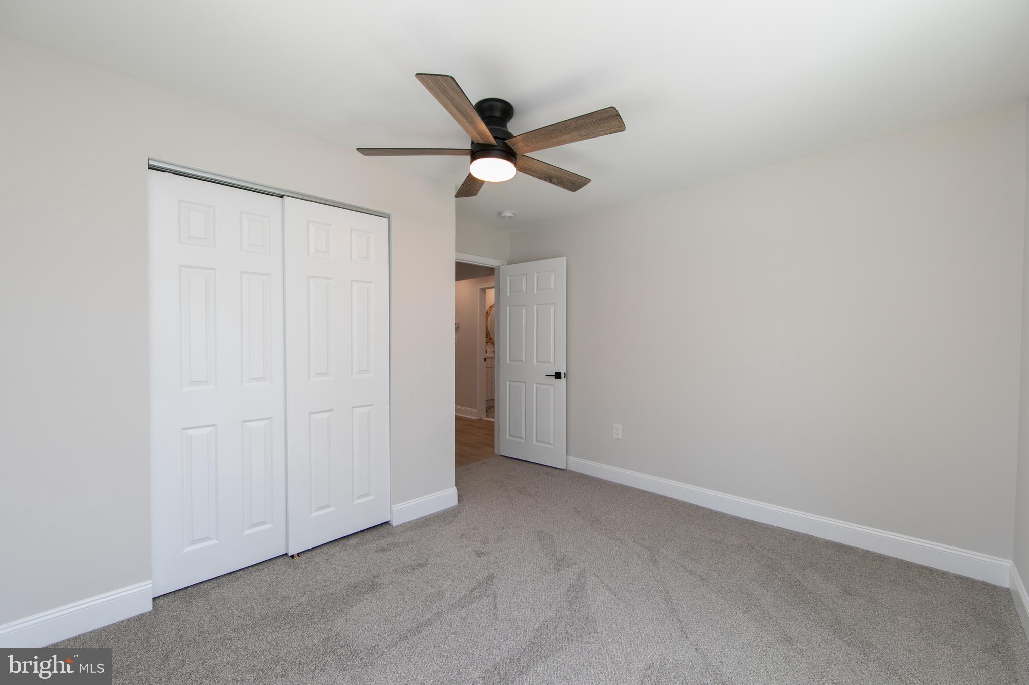 1324 Charleston Road Cherry Hill, NJ 08034 - Photo 19 of 34 an empty room with a ceiling fan and a window
