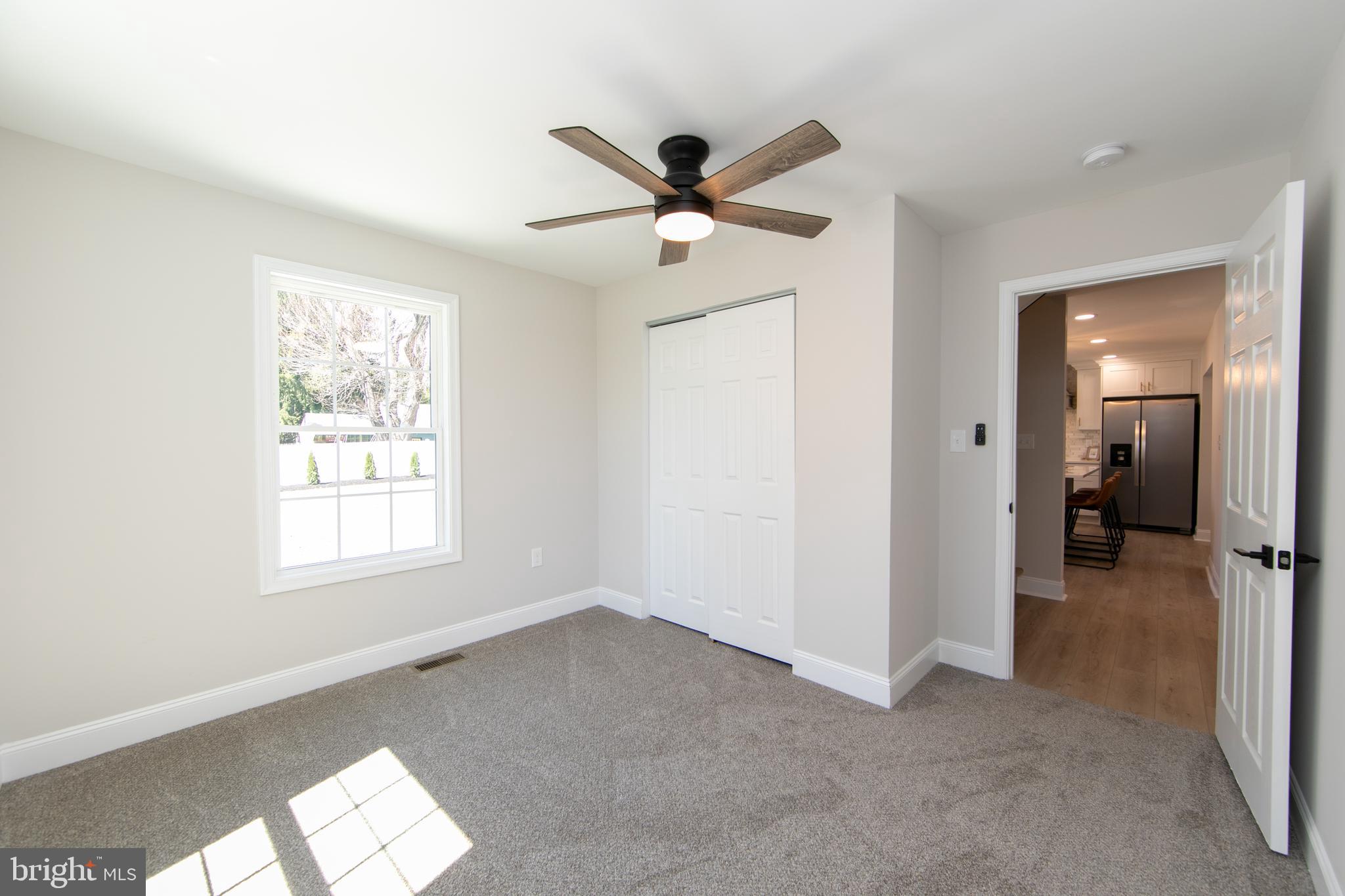 1324 Charleston Road Cherry Hill, NJ 08034 - Photo 20 of 34 a view of a livingroom with a ceiling fan and window