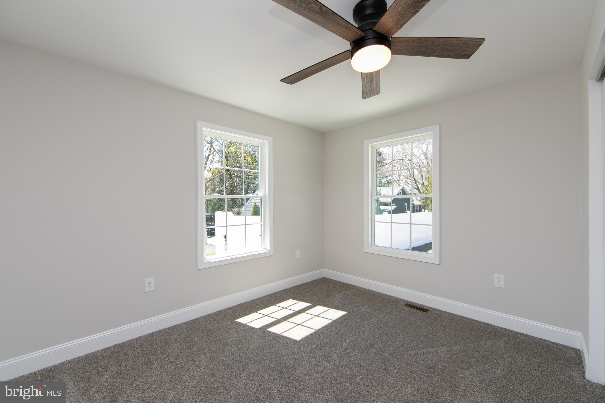 1324 Charleston Road Cherry Hill, NJ 08034 - Photo 21 of 34 en empty room with windows and ceiling fan