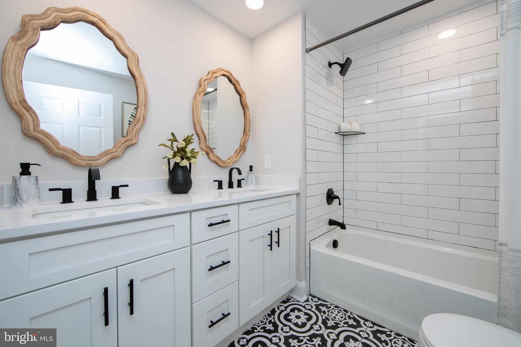 1324 Charleston Road Cherry Hill, NJ 08034 - Photo 22 of 34 a bathroom with a double vanity sink mirror toilet and bathtub