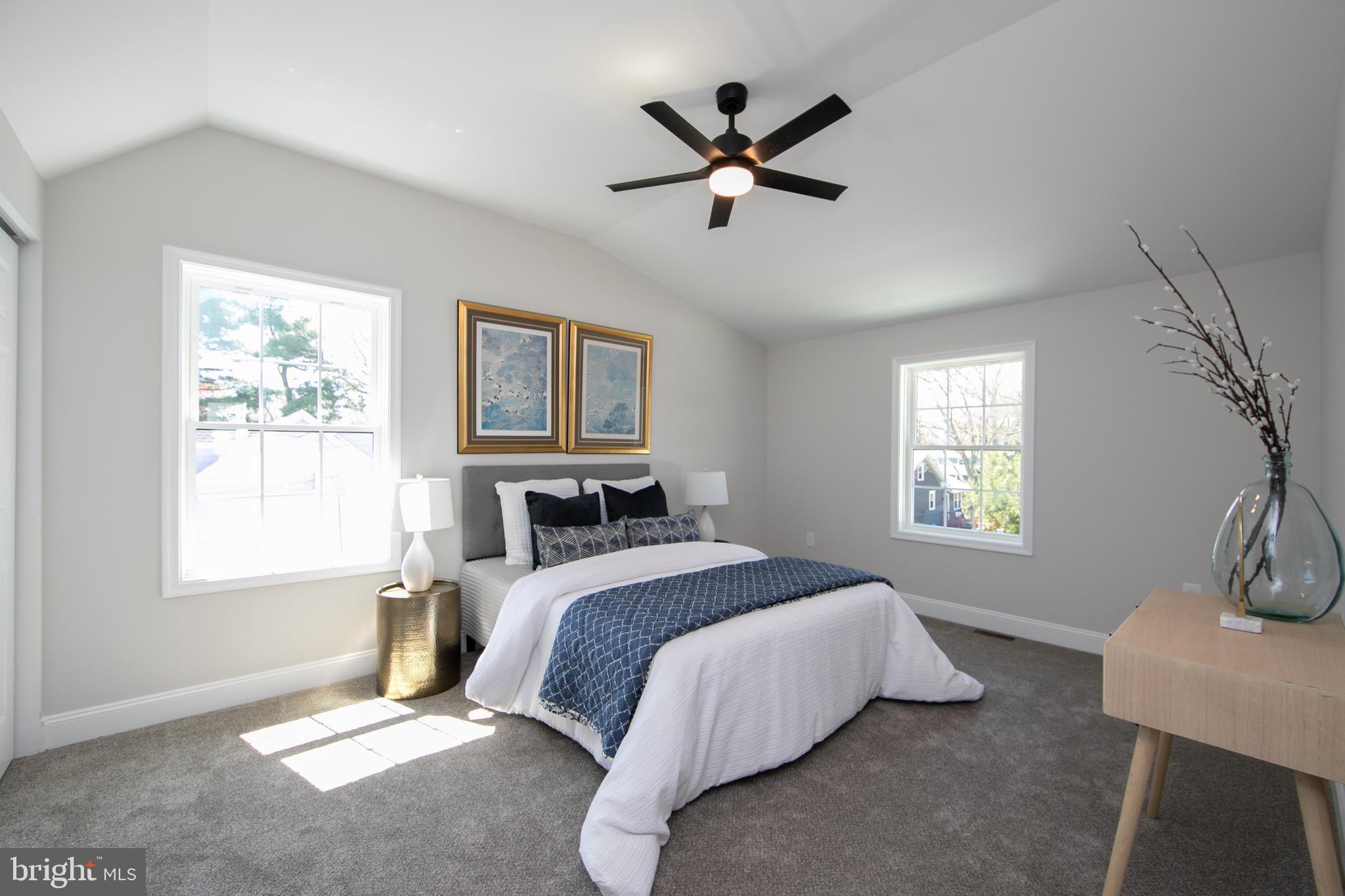 1324 Charleston Road Cherry Hill, NJ 08034 - Photo 25 of 34 a spacious bedroom with a bed a chandelier and a window