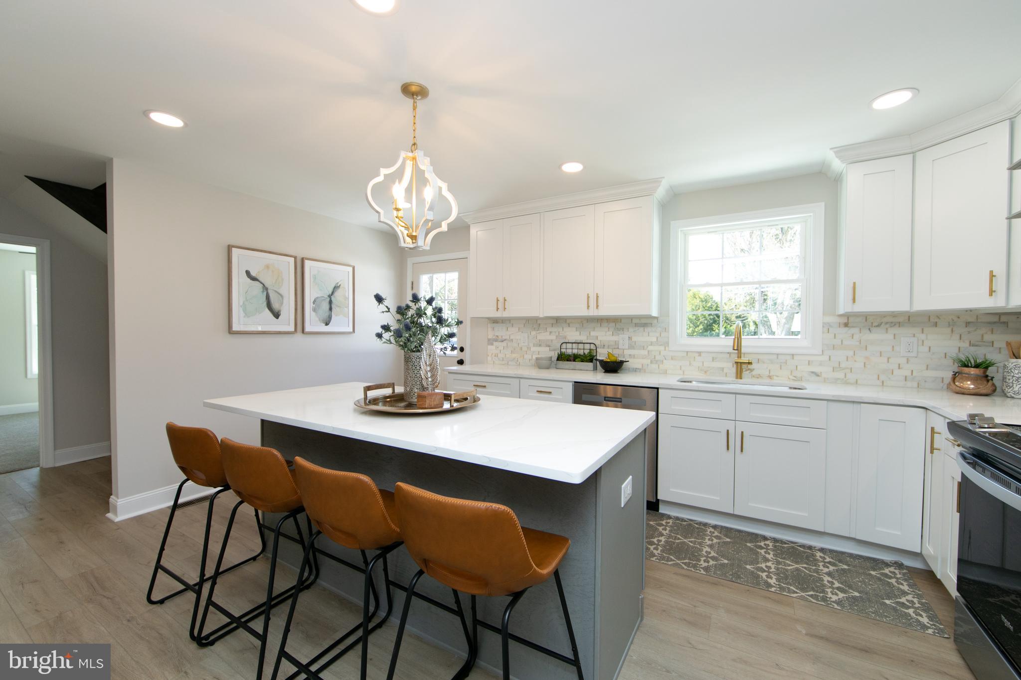 1324 Charleston Road Cherry Hill, NJ 08034 - Photo 10 of 34 a kitchen with a dining table chairs and microwave