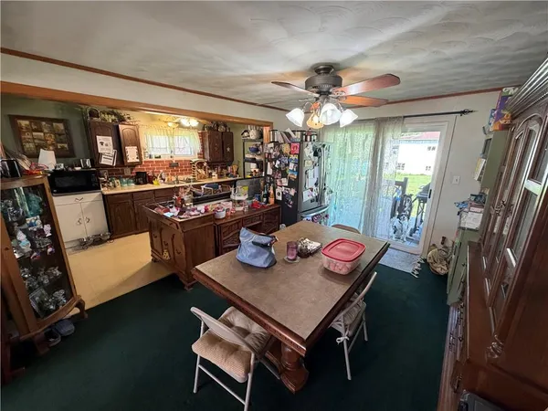 a view of a dining room with furniture window and outside view