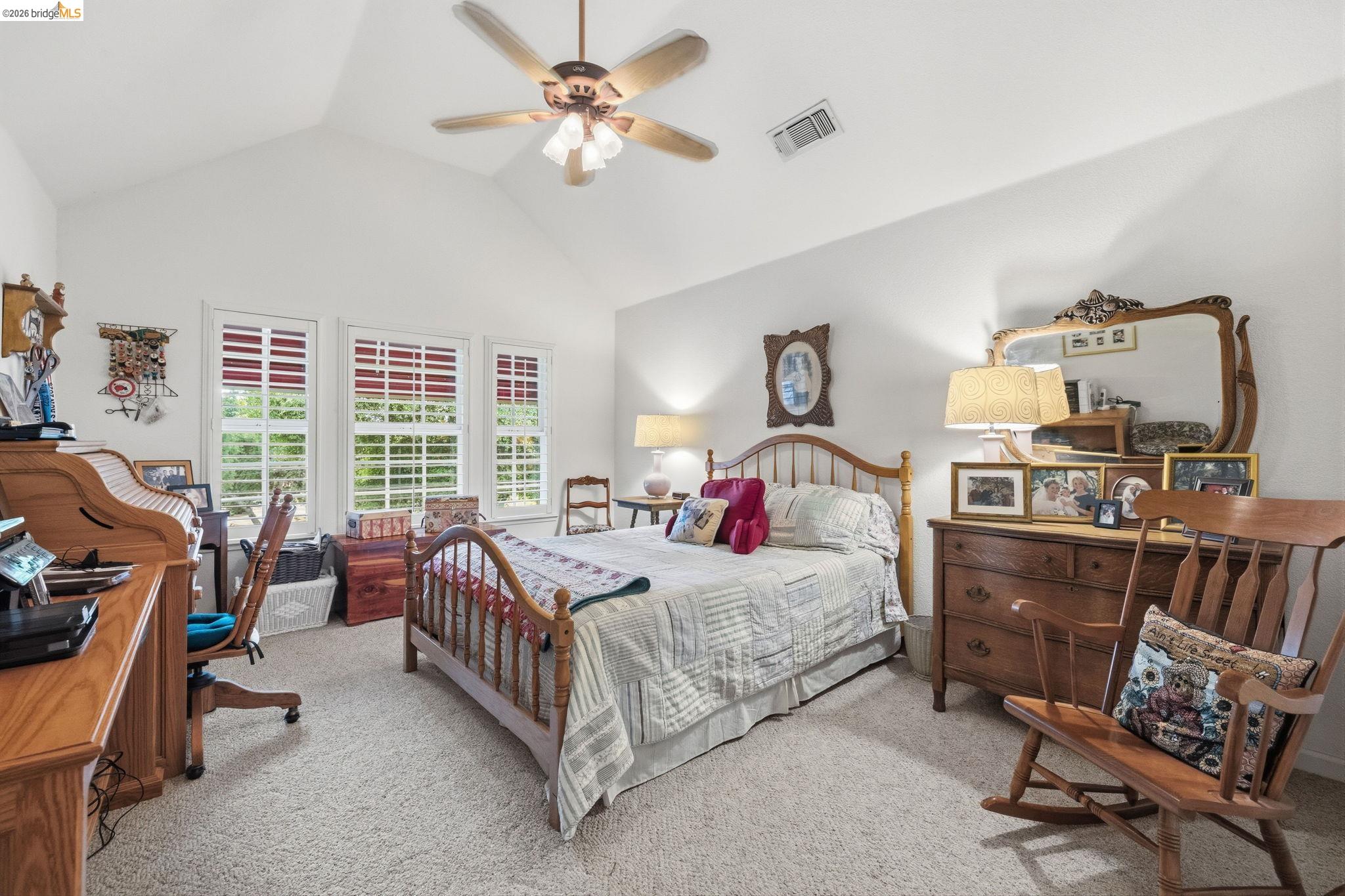 18450 Lambert Lake Road Sonora, CA 95370 - Photo 45 of 87 Spacious room featuring vaulted ceilings, a ceiling fan, and light-toned carpet
