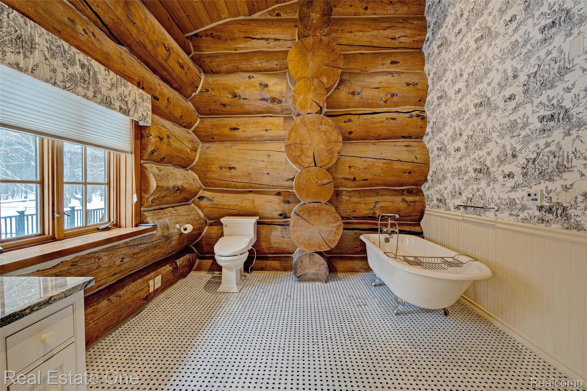 4340 Lahring Road Holly, MI 48442 - Photo 25 of 89 Full bath featuring wainscoting, a freestanding bath, vanity, and wallpapered walls