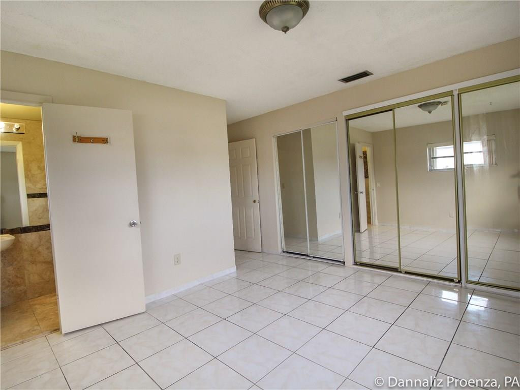 4720 Betelnut Street Boca Raton, FL 33428 - Photo 13 of 16 Master bedroom