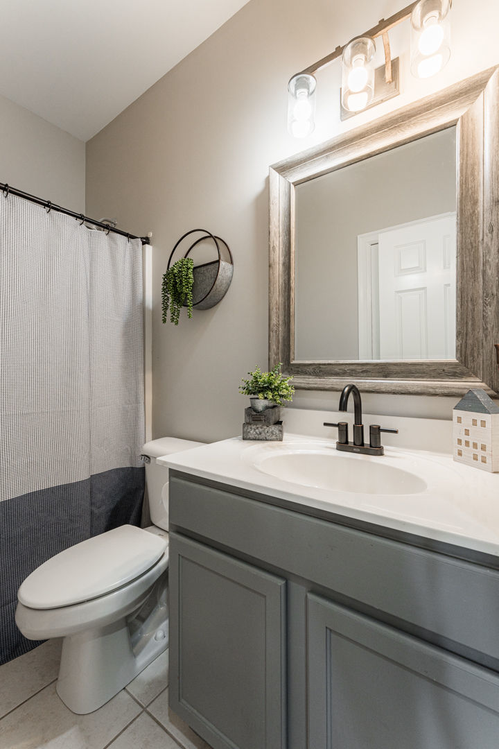 461 White Street Sycamore, IL 60178 - Photo 22 of 49 a bathroom with a sink vanity mirror and toilet