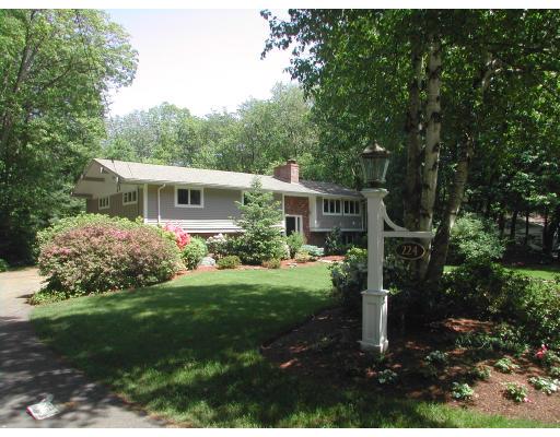 224 Country Way Needham, MA 02492 - Photo 1 of 20 a front view of house with a garden