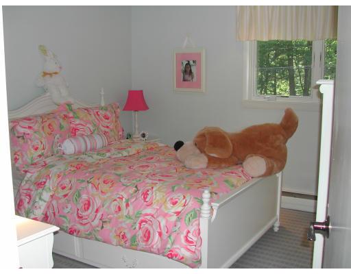 224 Country Way Needham, MA 02492 - Photo 11 of 20 a bedroom with a bed and a painting on the wall