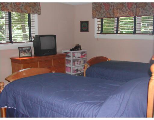 224 Country Way Needham, MA 02492 - Photo 12 of 20 a bed room with a bed and a tv