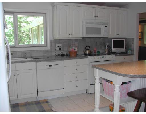 224 Country Way Needham, MA 02492 - Photo 6 of 20 a kitchen with stainless steel appliances white cabinets and a sink
