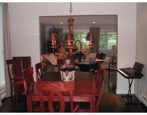 224 Country Way Needham, MA 02492 - Photo 10 of 20 a view of a dining room with furniture and chandelier