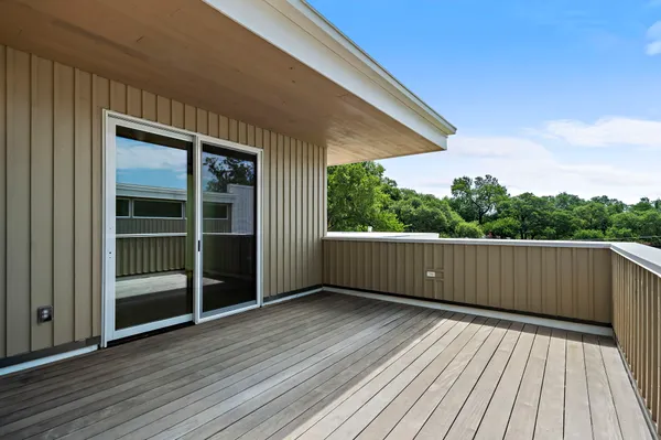 a view of outdoor space with wooden floor
