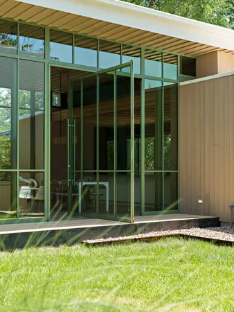 a view of a house with a backyard