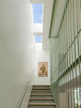 a view of a staircase with wooden floor and wall