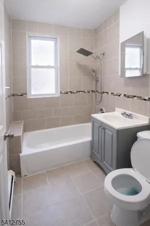 a bathroom with a sink toilet and bathtub