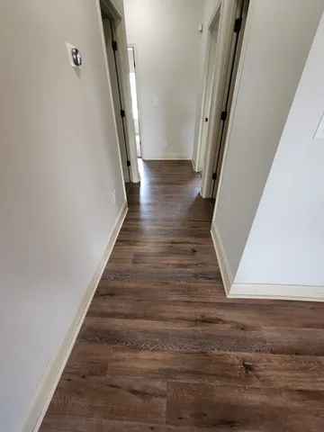 a view of a hallway with staircase