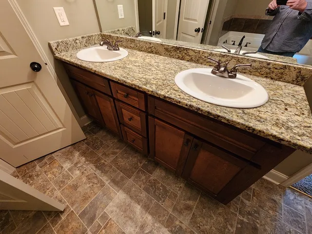 a bathroom with a sink and a mirror