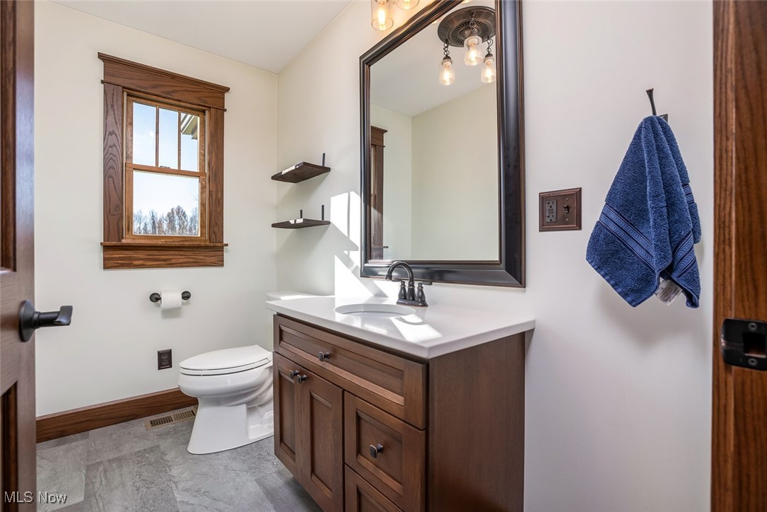 9615 Rural Dale Road Blue Rock, OH 43720 - Photo 20 of 50 Half bathroom featuring vanity and toilet