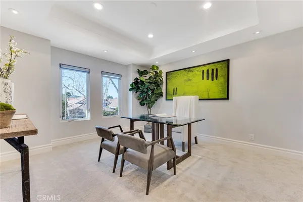 a view of a livingroom with furniture and a window