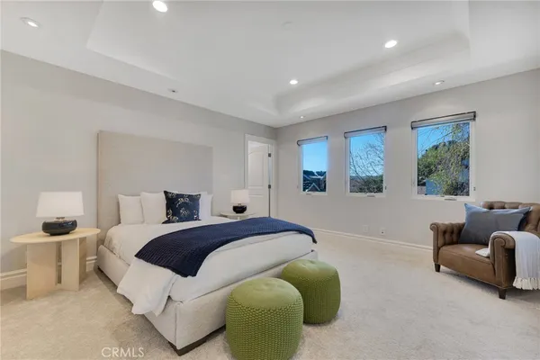 a bedroom with bed and furniture